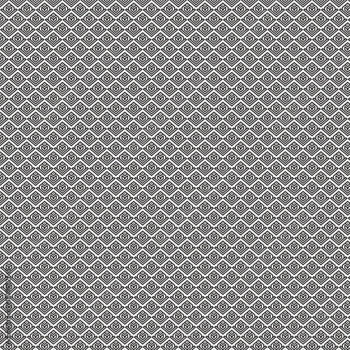 Intricate black and white geometric pattern with repeating tessellating motifs creating a complex visual texture