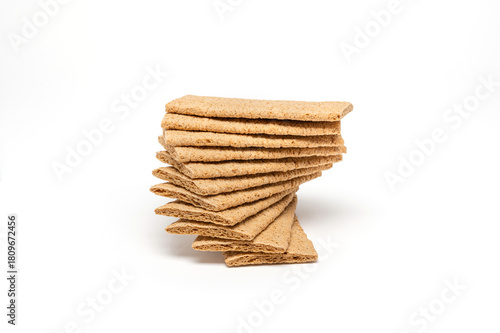 Airy crackers stacked on top of each other, horizontal  image with a white background.