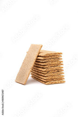 Airy crackers stacked on top of each other, vertical image with a white background.