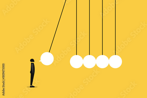 Businessman in front of newton's cradle with a chat bubble, concept of of speech or communication, Gossip and fake news