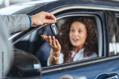 Canvas Print Happy Customer Receives Car Key Through Window During Purchase Exchange at Deale