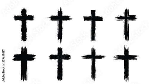 Collection of eight black grunge style crosses on white background