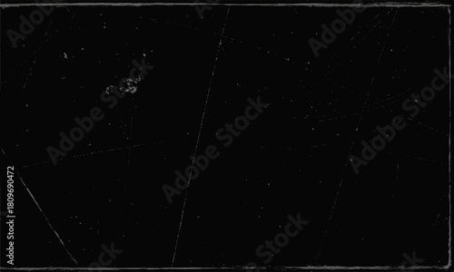 A dark, abstract grunge film strip of starry night sky galaxy dust and white snow particles