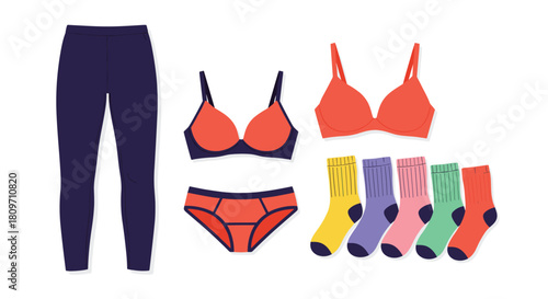 A stylish flat lay arrangement of women's undergarments and apparel featuring navy leggings a red bra and panty set and five pairs of colorful socks.