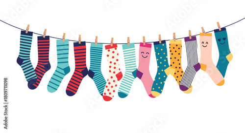 A cheerful collection of colorful and patterned socks with happy faces hanging on a clothesline with wooden pins against a white background.