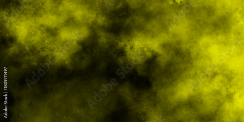 Yellow color powder explosion cloud isolated on black background.  dust smoke . Yellow dust particles explosion background .