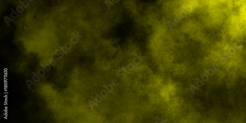 Yellow color powder explosion cloud isolated on black background.  dust smoke . Yellow dust particles explosion background .