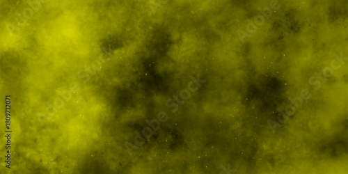 Yellow color powder explosion cloud isolated on black background.  dust smoke . Yellow dust particles explosion background .