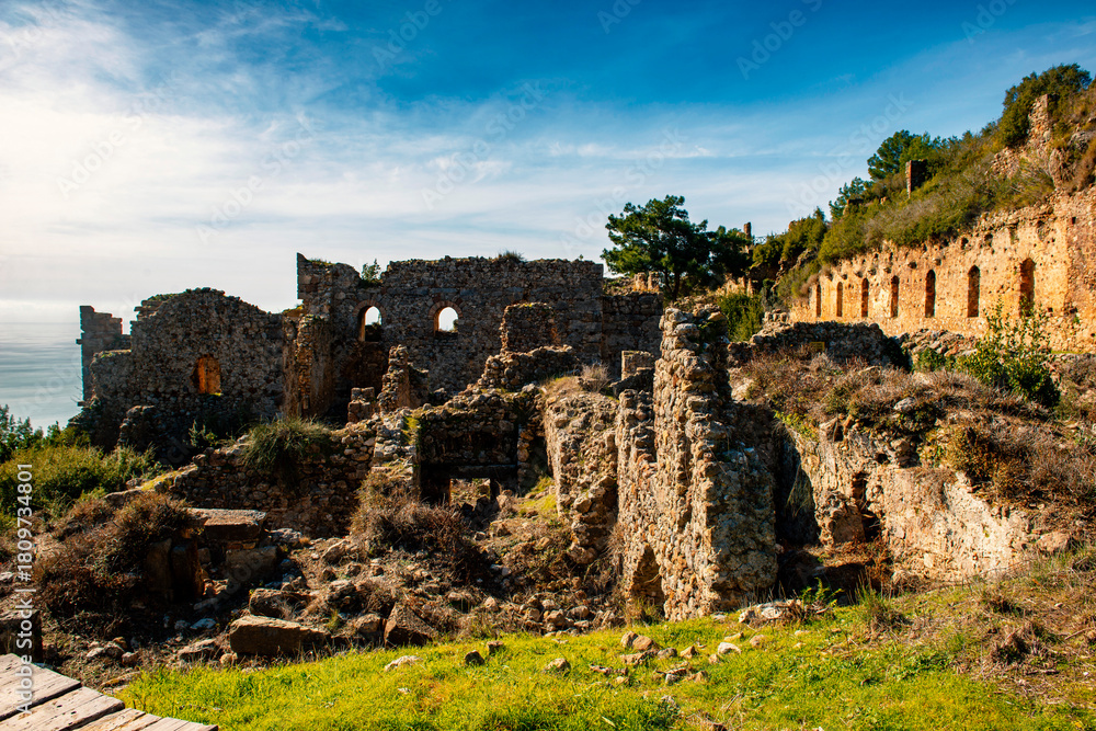 Fototapeta premium The ancient city of Syedra has located about 20 km. southeast of Alanya district of Antalya, on a mountainous area just west of the small coastal plain fed by the Sedre Stream. The city has developed 