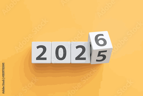 Wooden blocks displaying the transition from 2025 to 2026, symbolizing the upcoming new year and the passage of time on a vibrant orange background