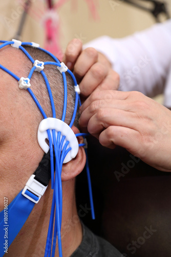 Electroencephalography (EEG) procedure. A noninvasive medical test that measures the brain's electrical activity.