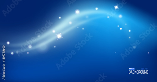Blue christmas glitter background with stars. Festive glowing blurred texture.