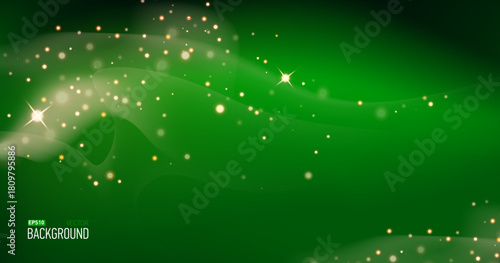 Green christmas glitter background with stars. Festive glowing blurred texture.