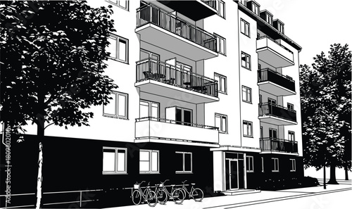 Modern apartment building with balconies, trees, and bicycles