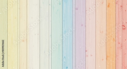Soft pastel rainbow stripes on a textured wooden surface creating a gentle and inviting background