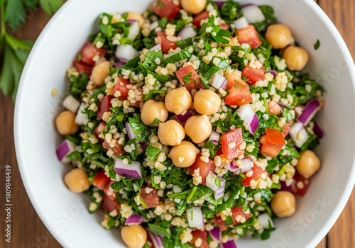 Enjoy vibrant tabbouleh salad with fresh herbs, tomatoes, and chickpeas, a healthy vegan delight for modern lifestyles and delicious summer meals