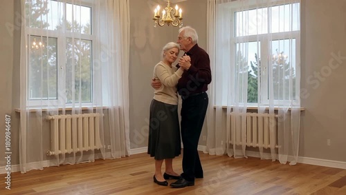 Elderly Couple Dancing Gracefully in an Empty Ballroom with Large Windows and Chandelier.