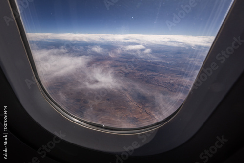 View form a commercial airliner of the American dessert and clouds