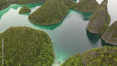 Raja Ampat, Indonesia: Aerial drone footage of the famous wayag viewpoint plateform overlooking a stunning lagoon in in Raja Ampat in west Papua in Indonesia.