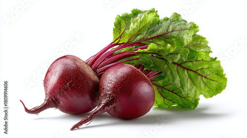 Freshly harvested red beets with vibrant green leaves, showcasing their natural beauty