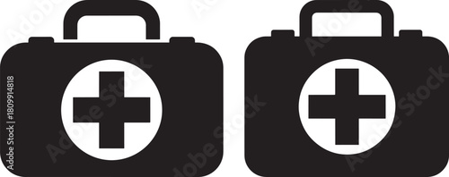 Two first aid kits with medical cross silhouette