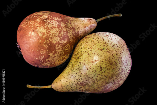 Ripe pears in closeup isolated on a black background