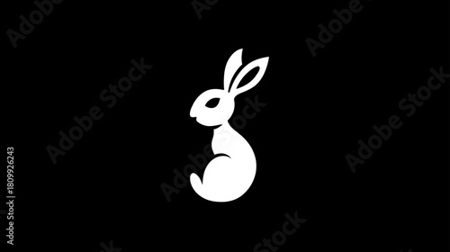 Minimalist White Rabbit Silhouette on Black Background. Simple Graphic Animal Icon or Logo Design Element.