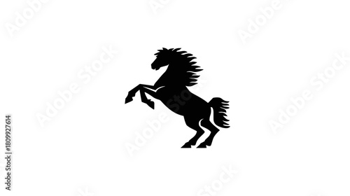 Dynamic black silhouette of a powerful horse rearing up on its hind legs, isolated on a clean white background.