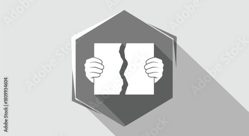 Hands tearing a paper in a gray diamond