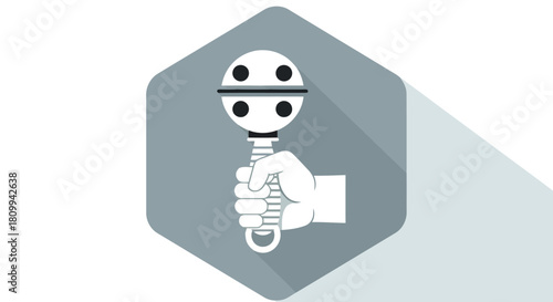 Illustration of a hand holding a baby rattle