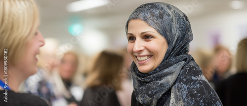Wallpaper Mural Woman in Hijab Smiling at Another Person in Modern Setting Torontodigital.ca