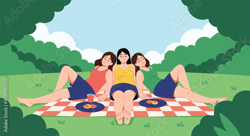 Three happy young women enjoying a relaxing summer picnic in the park sunbathing together on a red checkered blanket outdoors.