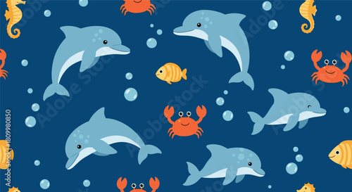 Cute seamless underwater pattern with playful dolphins orange crabs yellow fish and seahorses on a deep blue sea background.