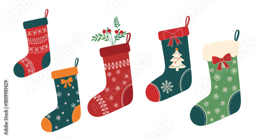 Festive collection of five unique hanging Christmas stockings in red green and blue with various holiday patterns.