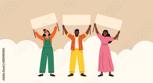 Diverse group of three young activists a man and two women stand together holding blank protest signs above their heads.