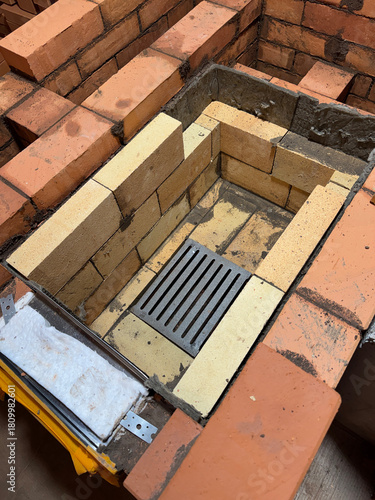 Formation of a fireclay core for a solid fuel furnace. Construction of a heating furnace.  Oblique Angle.