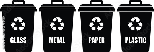 Four recycling bins for glass metal paper and plastic waste disposal