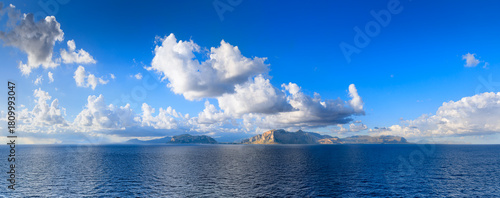 Panoramic view from the sea of ​​the Sicilian coast near Palermo, southern Italy: the Capo Gallo Nature Reserve in the center.