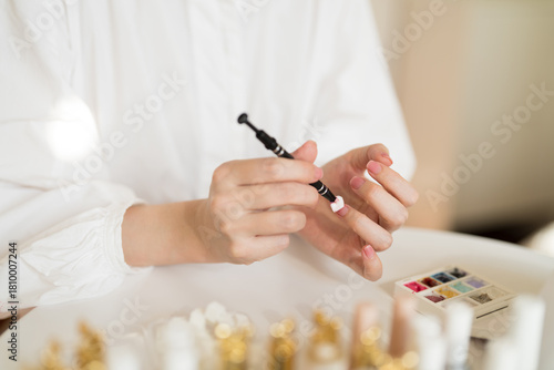 Apply smear Pat Glue to fingernails