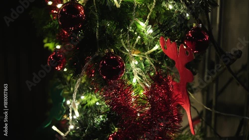 Festive holiday scene, cozy home holiday lighting display, nighttime festive scene with illuminated roof and cozy atmosphere