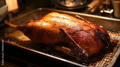 Roast duck on the grill in the restaurant. Roasted turkey, selective focus. Roast chicken with rosemary and spices 