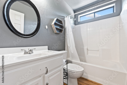 Modern Bathroom with White Fixtures and Natural Light