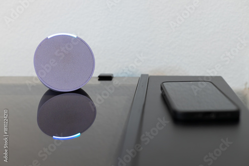 person controls smart wireless device with cell phone at home