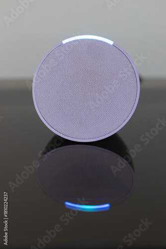 person controls smart wireless device with cell phone at home