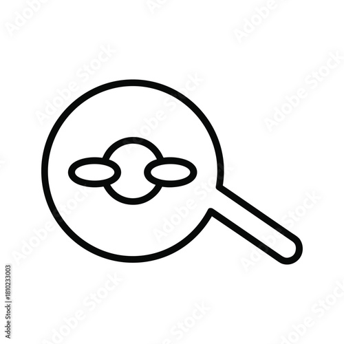 Magnifying glass examining a stylized representation of a molecule or atom with orbiting electrons