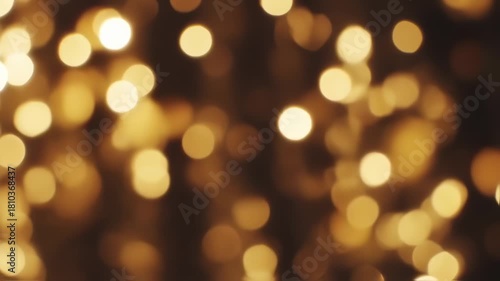 delicate dance of golden orbs, softly blurred, evokes a sense of cozy celebration and shimmering light in a dark surrounding space