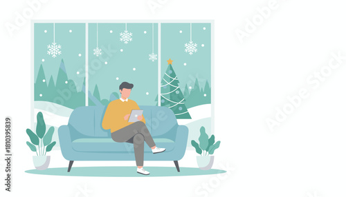 Man relaxing with a tablet on a sofa by the window overlooking a snowy Christmas scene
