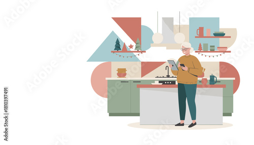 Senior woman using tablet and phone in a stylish kitchen decorated for the winter holidays