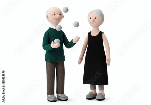 Stuffed dolls of an elderly man juggling white balls while a woman watches, symbolizing skill development, mental agility, and retirement fun