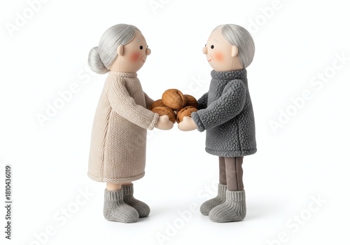 Stuffed dolls of an elderly couple holding a large pile of walnuts together, symbolizing nourishment, sharing, and harvest